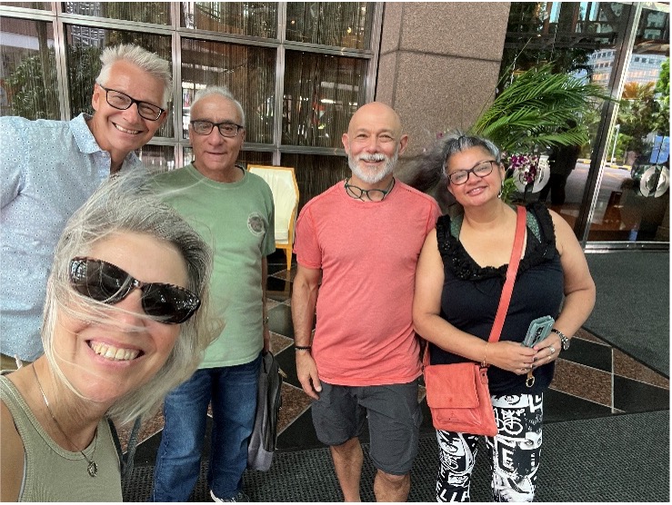 business colleagues smiling for a selfie.
