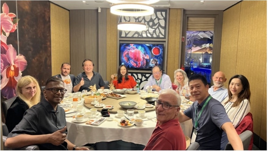 Diverse group of business people sitting around a table.