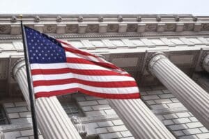American flag in front of a courthouse.